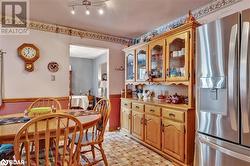 Kitchen featuring stainless steel fridge - 