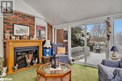 Living room with carpet flooring and lofted ceiling - 