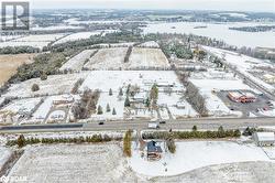 Snowy aerial view featuring a water view - 