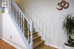 Staircase with hardwood / wood-style floors - 