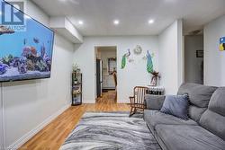 Living room featuring light wood-type flooring - 