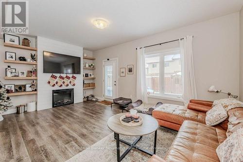 2 - 118 Simmonds Drive, Guelph (Waverley), ON - Indoor Photo Showing Living Room With Fireplace