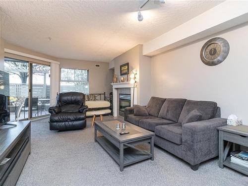 109-935 Johnson St, Victoria, BC - Indoor Photo Showing Living Room With Fireplace