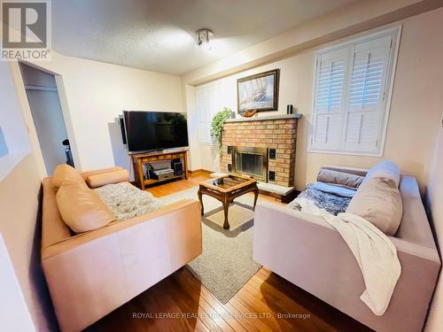 4504 Gullfoot Circle, Mississauga, ON - Indoor Photo Showing Living Room With Fireplace