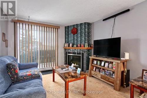 86 - 1096 Jalna Boulevard, London, ON - Indoor Photo Showing Living Room With Fireplace