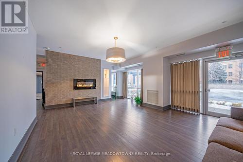 125 - 570 Lolita Gardens, Mississauga, ON - Indoor Photo Showing Living Room With Fireplace