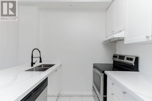 315 - 80 Aspen Springs Drive, Clarington, ON - Indoor Photo Showing Kitchen With Double Sink