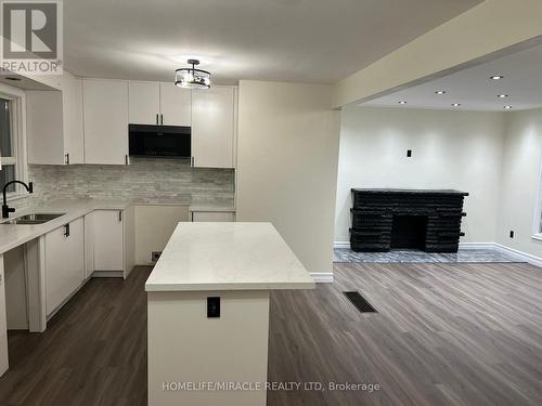 141 Chadburn Street, Oshawa, ON - Indoor Photo Showing Kitchen With Fireplace With Double Sink