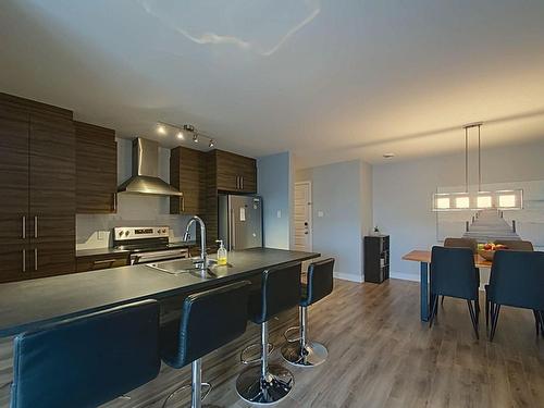 Cuisine - 407-10080 Rue De L'Épervier, Mirabel, QC - Indoor Photo Showing Kitchen With Double Sink