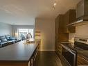 Cuisine - 407-10080 Rue De L'Épervier, Mirabel, QC  - Indoor Photo Showing Kitchen With Double Sink 