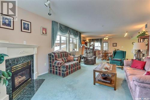 203 544 River Street E, Prince Albert, SK - Indoor Photo Showing Living Room With Fireplace