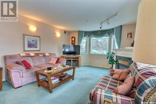 203 544 River Street E, Prince Albert, SK - Indoor Photo Showing Living Room With Fireplace