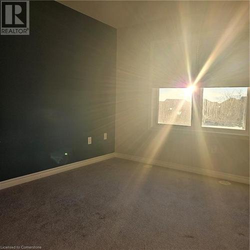 View of carpeted empty room - 39 Appleby Street, Kitchener, ON - Indoor Photo Showing Other Room