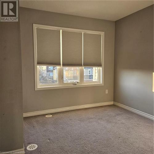 Empty room featuring carpet - 39 Appleby Street, Kitchener, ON - Indoor Photo Showing Other Room