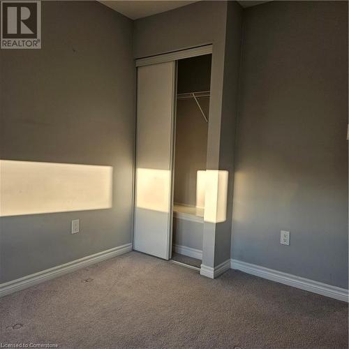 Unfurnished bedroom with carpet flooring and a closet - 39 Appleby Street, Kitchener, ON - Indoor Photo Showing Other Room