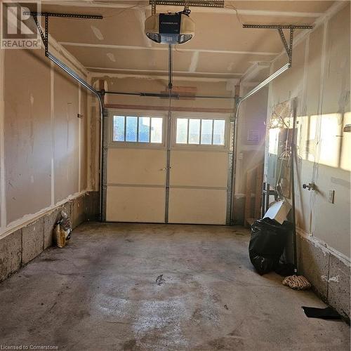 Garage featuring a garage door opener - 39 Appleby Street, Kitchener, ON - Indoor Photo Showing Garage