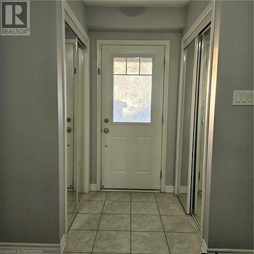 Doorway with light tile patterned floors - 39 Appleby Street, Kitchener, ON - Indoor Photo Showing Other Room