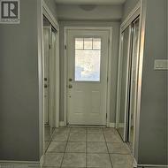 Doorway with light tile patterned floors - 