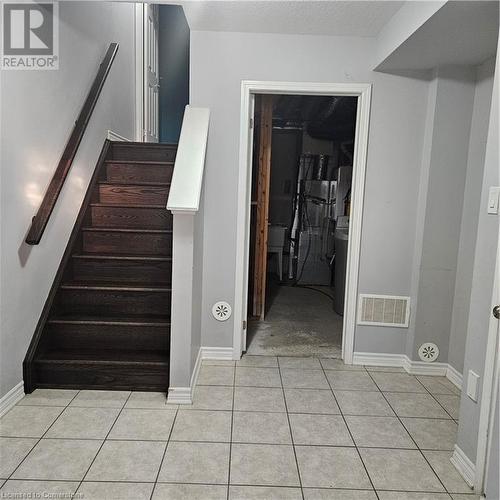 Staircase with tile patterned flooring - 39 Appleby Street, Kitchener, ON - Indoor Photo Showing Other Room