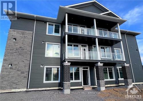 204 - 5872 County 19 Road, North Grenville, ON - Outdoor With Balcony With Facade