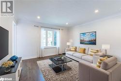 Living room featuring dark wood-type flooring - 