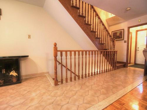 Escalier - 10695 Rue J.-J.-Gagnier, Montréal (Ahuntsic-Cartierville), QC - Indoor Photo Showing Other Room With Fireplace