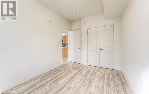 Unfurnished bedroom featuring a closet and light hardwood / wood-style flooring - 301 Westmount Road W Unit# 204, Kitchener, ON - Indoor Photo Showing Other Room