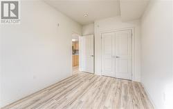 Unfurnished bedroom featuring a closet and light hardwood / wood-style flooring - 