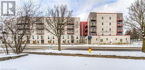 View of snow covered building - 301 Westmount Road W Unit# 204, Kitchener, ON - Outdoor