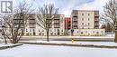 View of snow covered building - 301 Westmount Road W Unit# 204, Kitchener, ON  - Outdoor 