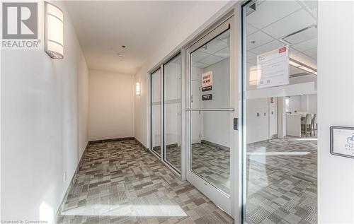 Hallway featuring carpet and a paneled ceiling - 301 Westmount Road W Unit# 204, Kitchener, ON - Indoor Photo Showing Other Room