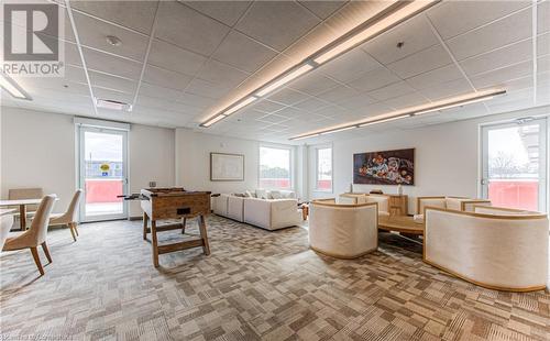 Carpeted living room with plenty of natural light - 301 Westmount Road W Unit# 204, Kitchener, ON - Indoor