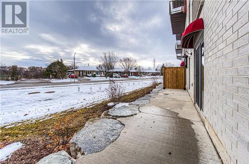 View of yard covered in snow - 301 Westmount Road W Unit# 204, Kitchener, ON - Outdoor