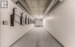 Hallway featuring concrete floors - 