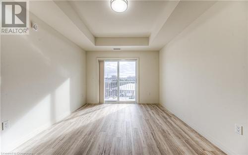 Unfurnished room with a raised ceiling and light hardwood / wood-style floors - 301 Westmount Road W Unit# 204, Kitchener, ON - Indoor Photo Showing Other Room