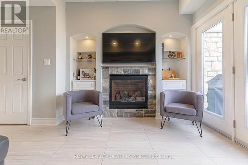 15 - 209707 Hwy 26, Blue Mountains, ON - Indoor Photo Showing Living Room With Fireplace