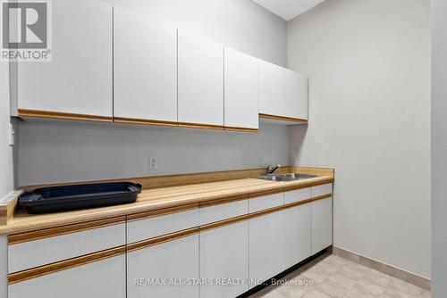 208 - 2 Heritage Way, Kawartha Lakes, ON - Indoor Photo Showing Kitchen With Double Sink