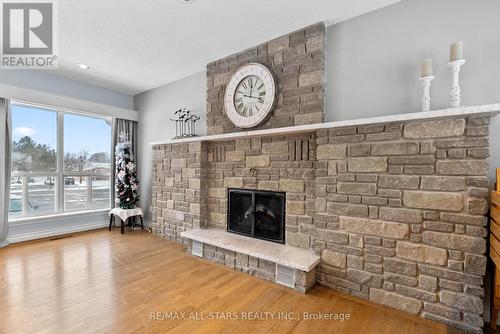 208 - 2 Heritage Way, Kawartha Lakes, ON - Indoor Photo Showing Living Room With Fireplace