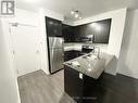 1119 - 15 James Finlay Way, Toronto, ON  - Indoor Photo Showing Kitchen With Stainless Steel Kitchen With Double Sink With Upgraded Kitchen 