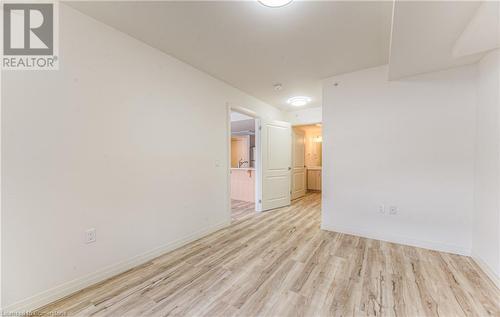 Empty room with light wood-type flooring - 301 Westmount Road W Unit# G1, Kitchener, ON - Indoor Photo Showing Other Room