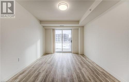 Unfurnished room featuring light hardwood / wood-style flooring - 301 Westmount Road W Unit# G1, Kitchener, ON - Indoor Photo Showing Other Room