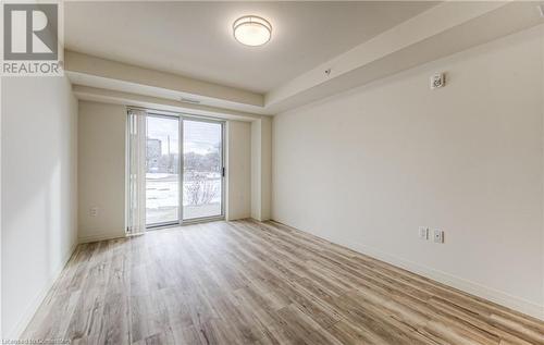 Unfurnished room featuring light hardwood / wood-style flooring - 301 Westmount Road W Unit# G1, Kitchener, ON - Indoor Photo Showing Other Room