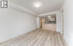 Unfurnished living room with light hardwood / wood-style flooring - 