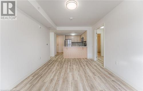 Unfurnished living room featuring light wood-type flooring - 301 Westmount Road W Unit# G1, Kitchener, ON - Indoor