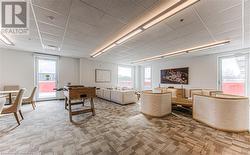 Living room featuring carpet and plenty of natural light - 