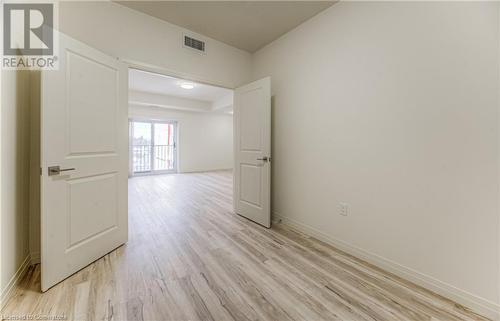 Empty room with light hardwood / wood-style flooring - 301 Westmount Road W Unit# 414, Kitchener, ON - Indoor Photo Showing Other Room