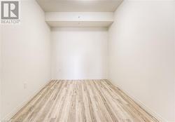 Unfurnished room with light hardwood / wood-style flooring - 