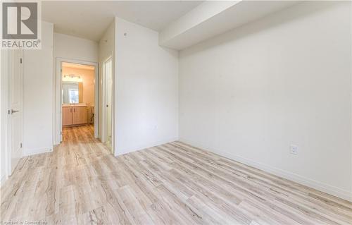 Spare room featuring light hardwood / wood-style flooring - 301 Westmount Road W Unit# 414, Kitchener, ON - Indoor Photo Showing Other Room