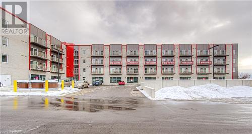 View of snow covered building - 301 Westmount Road W Unit# 414, Kitchener, ON - Outdoor With Facade