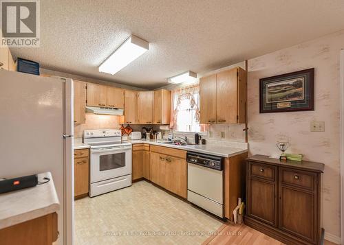 56 Tecumseth Pines Drive, New Tecumseth, ON - Indoor Photo Showing Kitchen With Double Sink